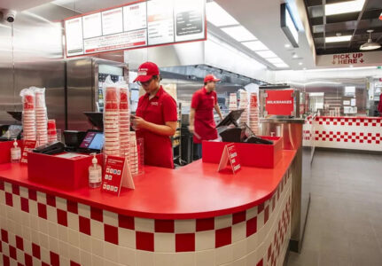 Staff behind counter at Five Guys